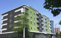 green and dark gray condominium white windows