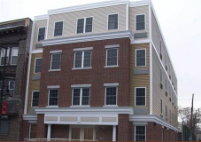 ritz craft apartment commercial brick front tan siding